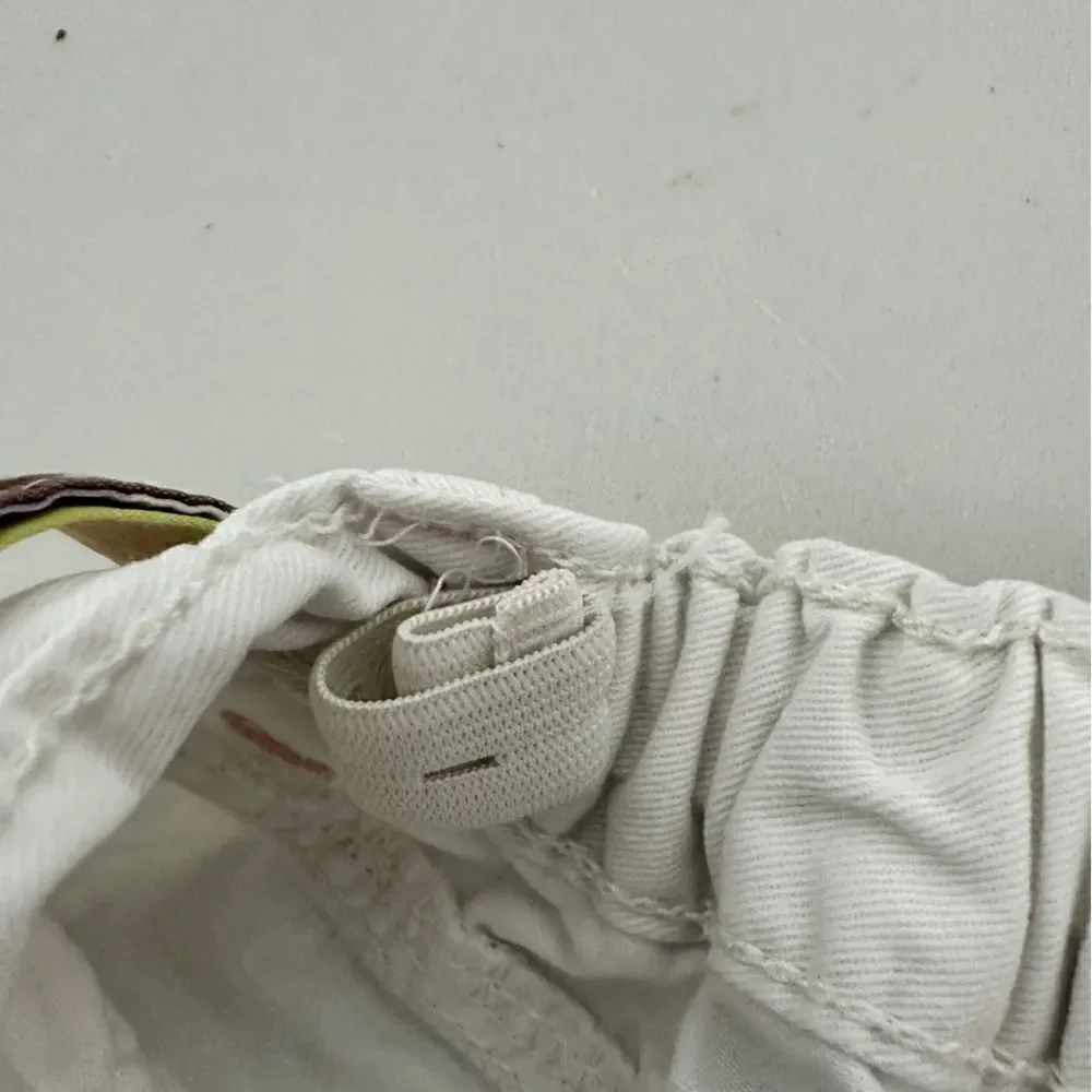 Gymboree girls white shorts with a colorful belt tie. Size 7.